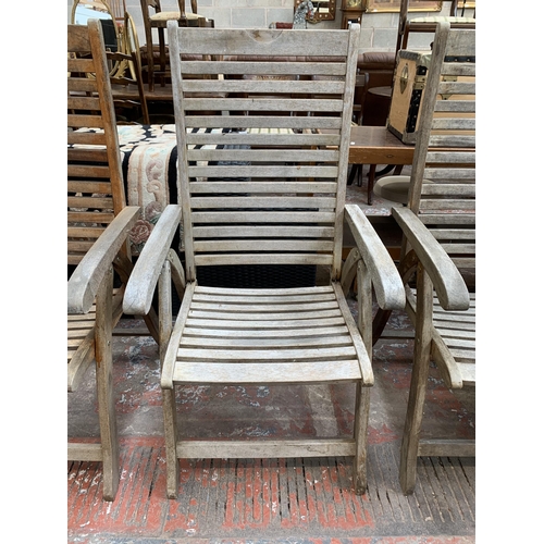 97 - Four Pagoda teak folding garden armchairs