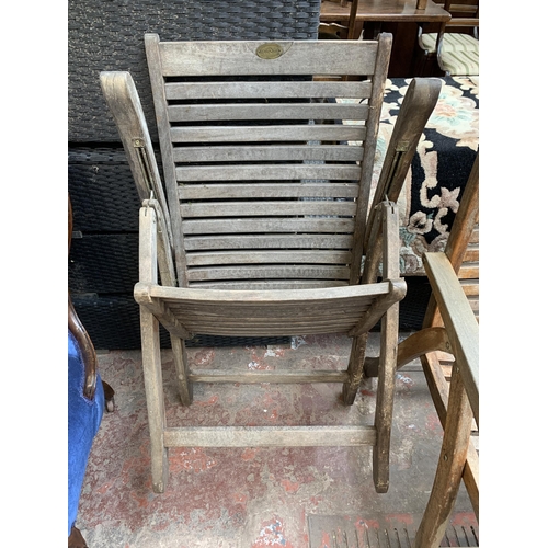 97 - Four Pagoda teak folding garden armchairs