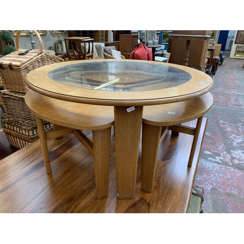 98 - A mid 20th century teak effect nest of tables - approx. 43cm high x 86cm diameter