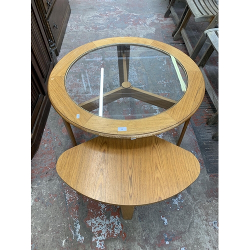 98 - A mid 20th century teak effect nest of tables - approx. 43cm high x 86cm diameter