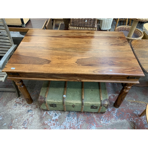 99 - An Indian sheesham wood rectangular dining table - approx. 77cm high x 90cm wide x 145cm long