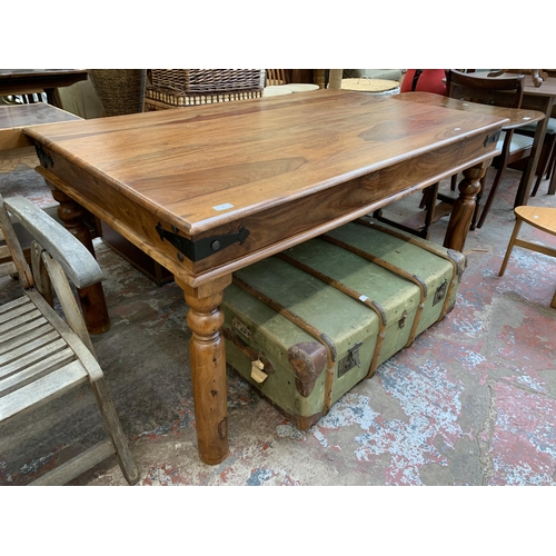 99 - An Indian sheesham wood rectangular dining table - approx. 77cm high x 90cm wide x 145cm long