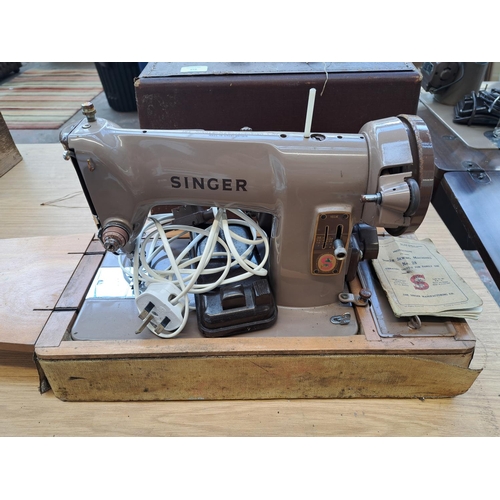 818 - A cased Singer 185K electric sewing machine with foot pedal