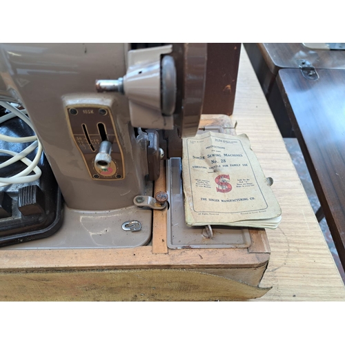 818 - A cased Singer 185K electric sewing machine with foot pedal