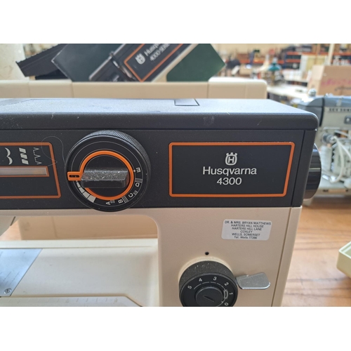 821 - A cased Husqvarna 4300 electric sewing machine with foot pedal and instruction manual