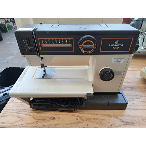 821 - A cased Husqvarna 4300 electric sewing machine with foot pedal and instruction manual