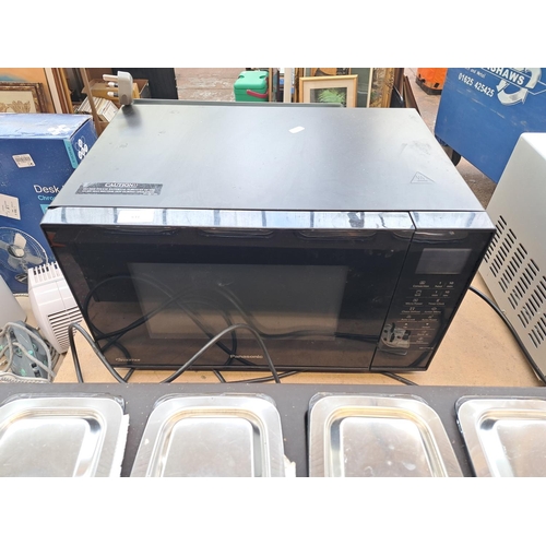 831 - Two items, one Panasonic NN-CT56JB inverter microwave oven and one Philips Hostess four section tabl... 