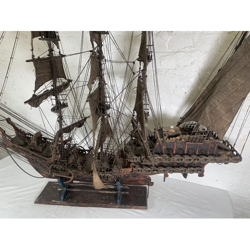 172 - A hand-painted resin and wood model ship on stand - approx. 120cm high x 156cm long