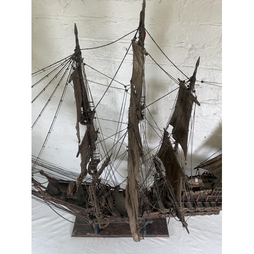 172 - A hand-painted resin and wood model ship on stand - approx. 120cm high x 156cm long