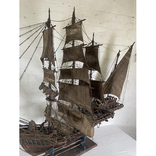 172 - A hand-painted resin and wood model ship on stand - approx. 120cm high x 156cm long