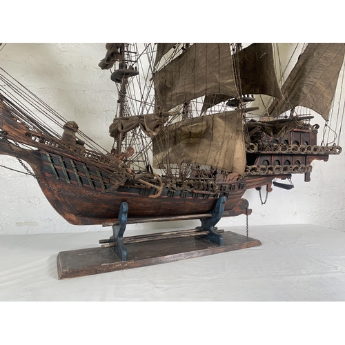 172 - A hand-painted resin and wood model ship on stand - approx. 120cm high x 156cm long