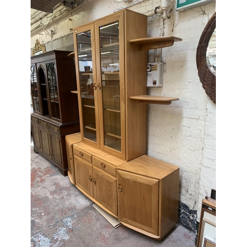 18 - An Ercol Windsor blonde elm display unit - approx. 214cm high x 181cm wide x 45cm deep