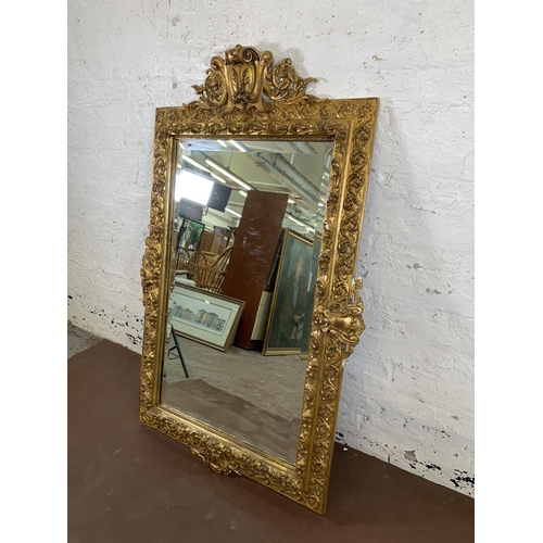 2 - A Rococo style gilt framed bevelled edge wall mirror - approx. 140cm high x 92cm wide