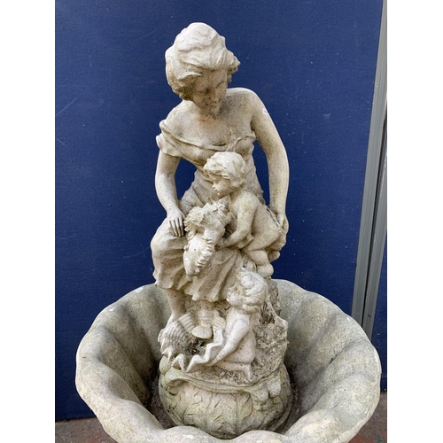 52 - A 19th century style stone effect fibreglass figural pedestal water fountain - approx. 130cm high x ... 