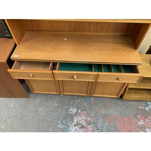 133 - A mid 20th century teak display unit