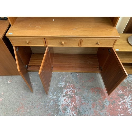 133 - A mid 20th century teak display unit