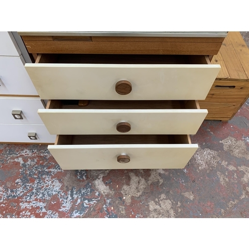 193 - A mid 20th century teak and white laminate mirror door wardrobe