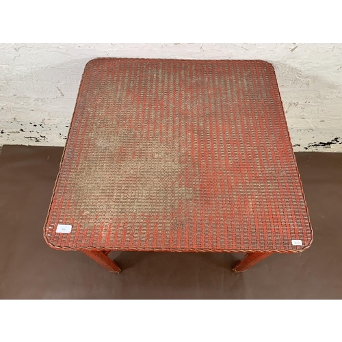 200 - A mid 20th century Lloyd Loom red painted square occasional table - approx. 69cm high x 70cm square