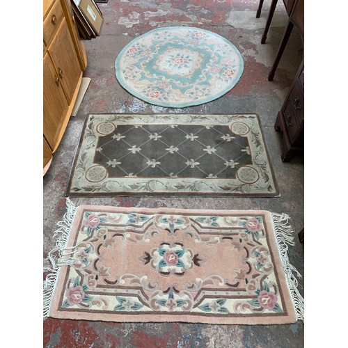 20A - Three floral pattern rugs