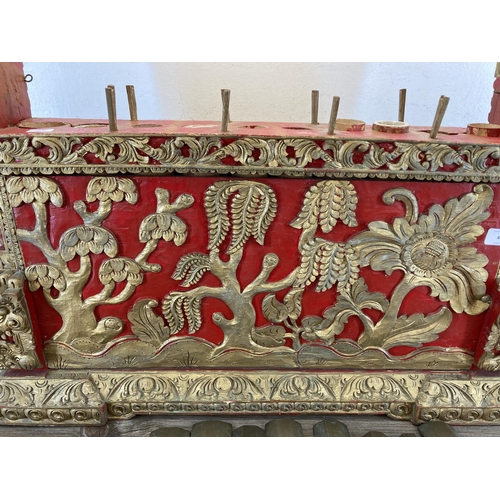 572 - An early/mid 20th century Indonesian hand carved and painted wooden Gamelan - approx. 59cm high x 72... 