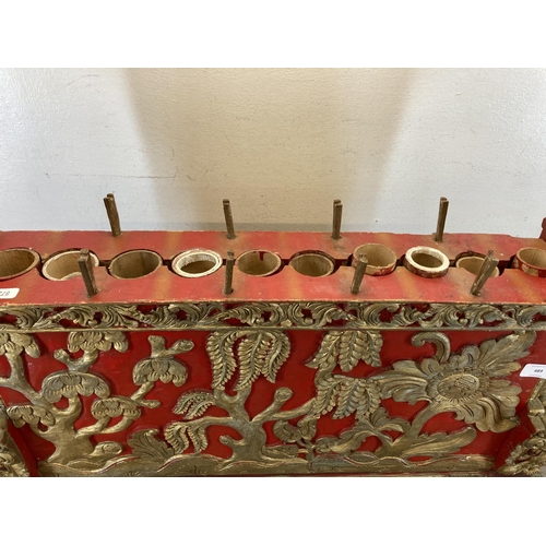 572 - An early/mid 20th century Indonesian hand carved and painted wooden Gamelan - approx. 59cm high x 72... 