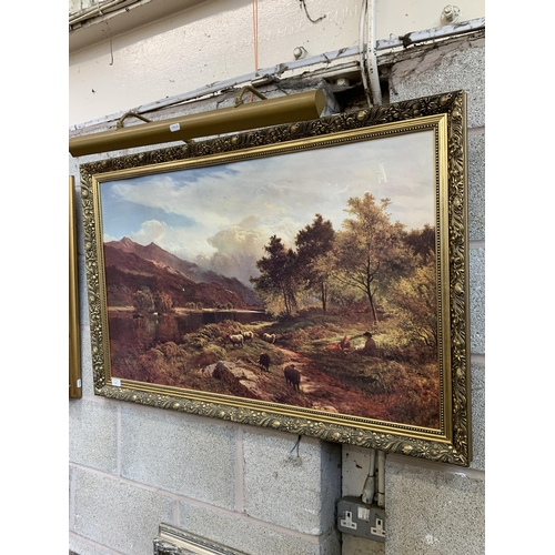 252 - A gilt framed landscape scene print with picture light - approx. 71cm high x 110cm wide