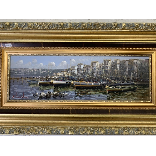 266 - A 20th century gilt framed oil on canvas of a harbour scene signed lower left - approx. 46cm high x ... 