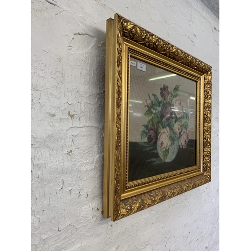 268 - A Victorian style gilt framed floral embroidered picture - approx. 52cm high x 56cm wide