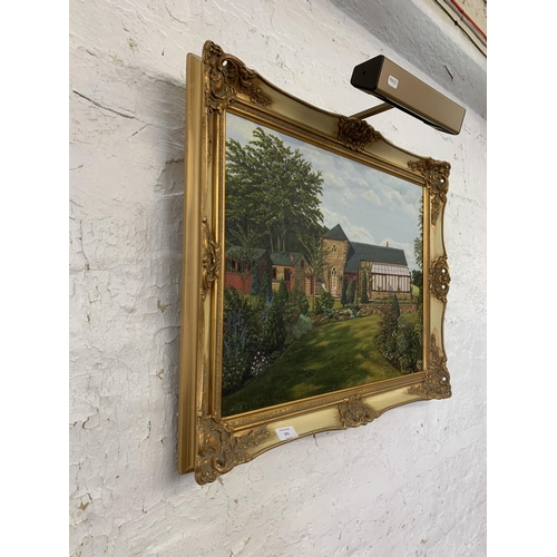 271 - A gilt framed A.E. Glover oil on canvas with picture light - approx. 57cm high x 72cm wide