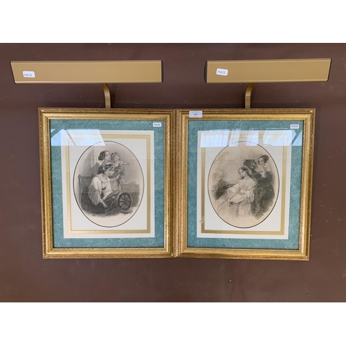 276 - Two gilt framed mother and child engravings with picture lights - approx. 46cm high x 40cm wide