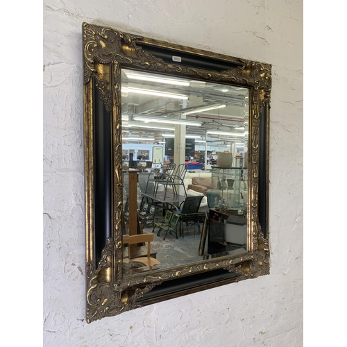 294 - A 19th century style black lacquer and gilt framed bevelled edge wall mirror - approx. 66cm high x 5... 