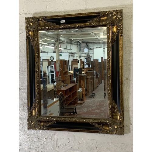 294 - A 19th century style black lacquer and gilt framed bevelled edge wall mirror - approx. 66cm high x 5... 