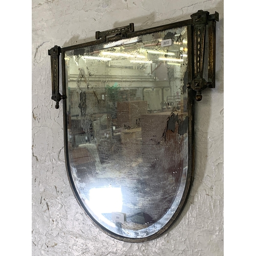 297 - An Art Deco metal framed bevelled edge wall mirror - approx. 48cm high x 48cm wide