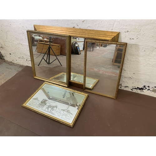 305 - Four gilt framed wall mirrors - largest approx. 109cm high x 78cm wide