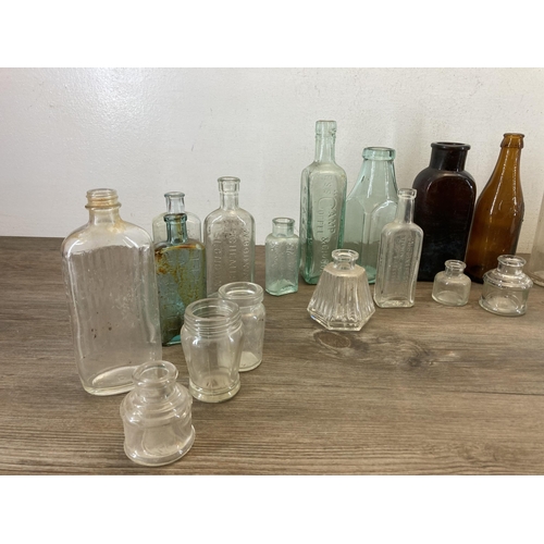 359 - A collection of ceramics and glassware to include vintage glass bottles, early 20th century stonewar... 