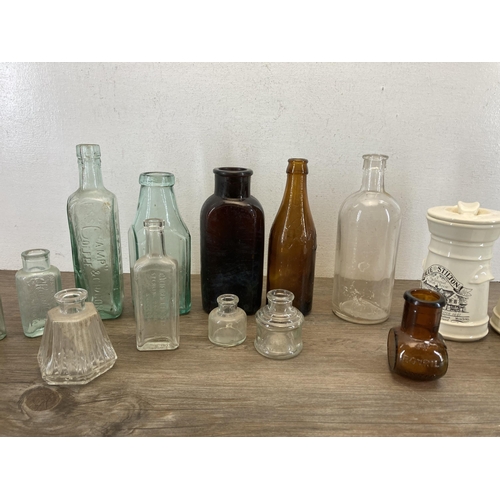 359 - A collection of ceramics and glassware to include vintage glass bottles, early 20th century stonewar... 