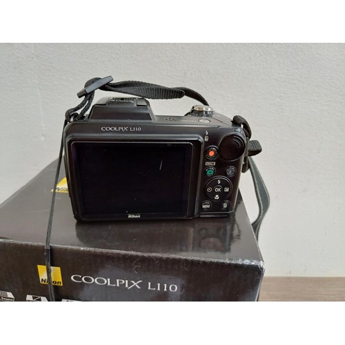 642 - Two Nikon Coolpix compact digital bridge cameras, one boxed L110 12.1mp with cable software disc and... 