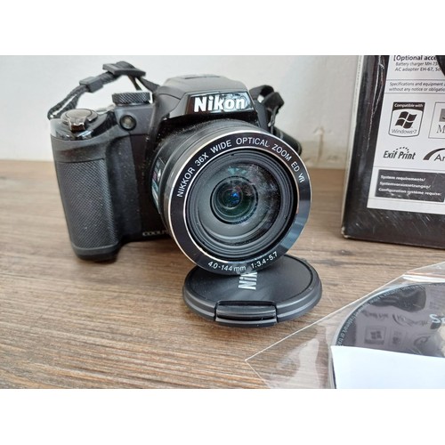 642 - Two Nikon Coolpix compact digital bridge cameras, one boxed L110 12.1mp with cable software disc and... 