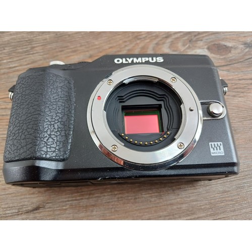 645 - Two Olympus compact digital cameras, one SP-600UZ 12mp bridge and one Pen E-PL2 12.3mp micro four-th... 