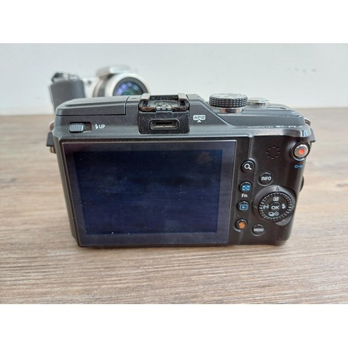 645 - Two Olympus compact digital cameras, one SP-600UZ 12mp bridge and one Pen E-PL2 12.3mp micro four-th... 