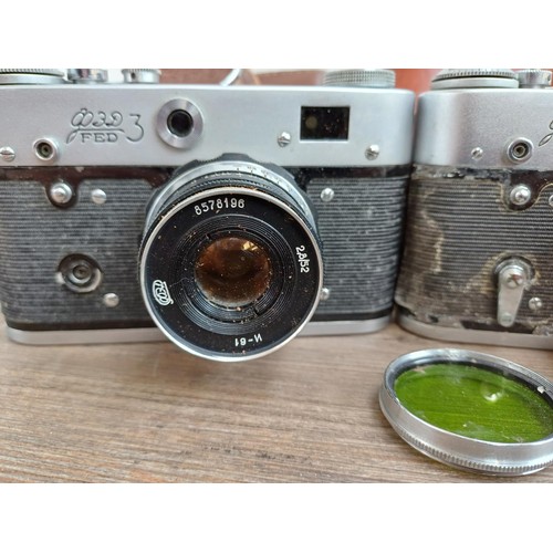 646 - Three cased FED 35mm screwmount rangefinder cameras, one FED 3b  fitted with Industar 61 2.8/52 lens... 