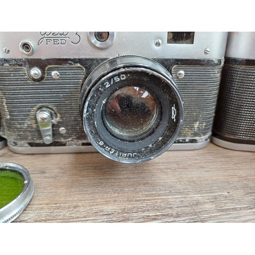 646 - Three cased FED 35mm screwmount rangefinder cameras, one FED 3b  fitted with Industar 61 2.8/52 lens... 