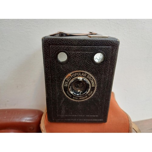 647 - Seven vintage cameras, two Haking Halina 35X compact 35mm viewfinder, one Kodak Brownie Six-20 model... 