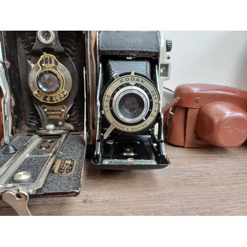 647 - Seven vintage cameras, two Haking Halina 35X compact 35mm viewfinder, one Kodak Brownie Six-20 model... 