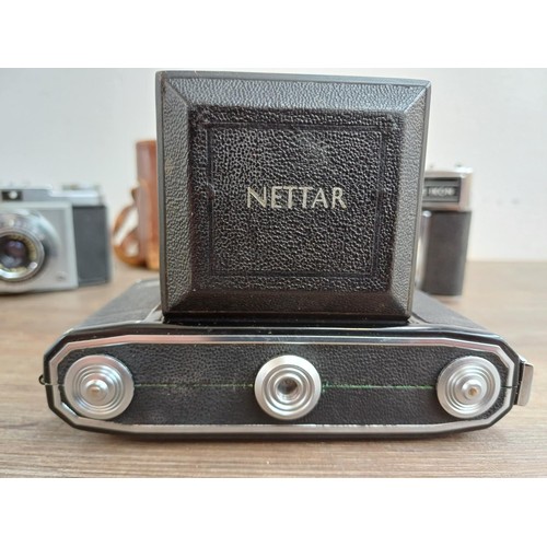 648 - Three Zeiss Ikon cameras, one Contessamat STE 35mm rangefinder, one Contina 526/24 35mm viewfinder a... 