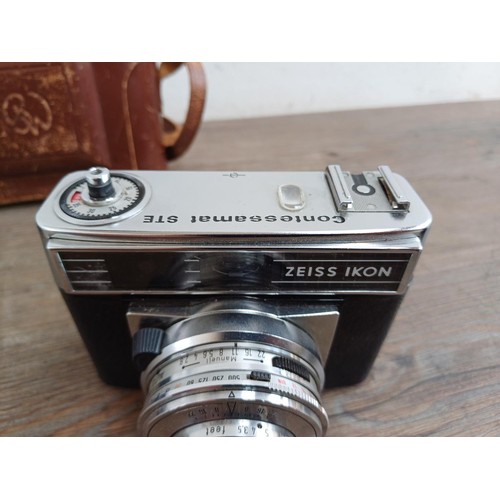 648 - Three Zeiss Ikon cameras, one Contessamat STE 35mm rangefinder, one Contina 526/24 35mm viewfinder a... 