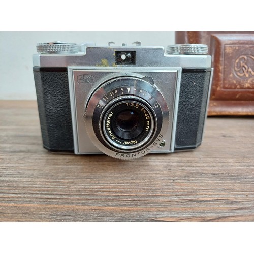 648 - Three Zeiss Ikon cameras, one Contessamat STE 35mm rangefinder, one Contina 526/24 35mm viewfinder a... 