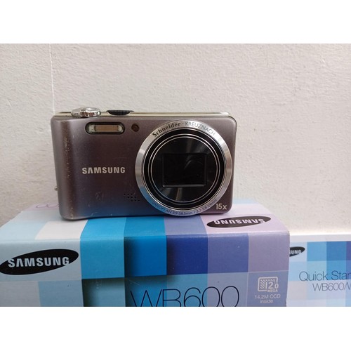 649 - Two Samsung compact digital cameras, one boxed WB600 12mp with charger, software disc and instructio... 