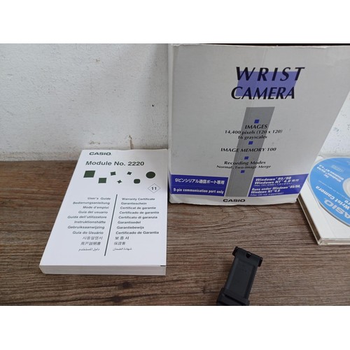 651 - A boxed Casio WQV-1 wrist camera with PAD-2, software disc and instruction manual