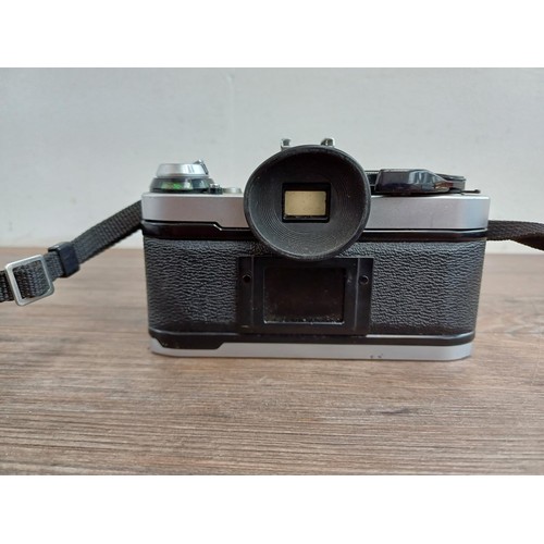 653 - Two Canon AE-1 Program 35mm SLR cameras, one fitted with Tamron SP 1:4-4.5 28-135mm lens and one fit... 